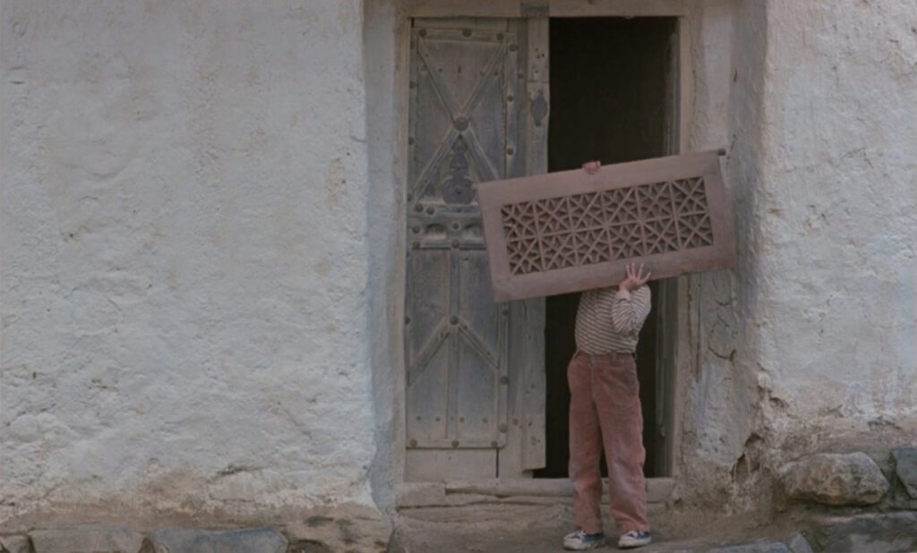 Where Is My Friend's Home? - Abbas Kiarostami - door - shutter - boy - pants - Poshteh