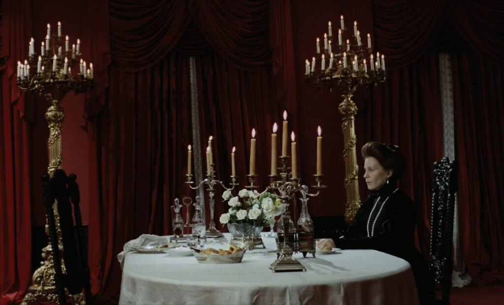 Cries and Whispers - Viskningar och rop - Ingmar Bergman - Ingrid Thulin - Karin - candelabras - table - curtains - candles