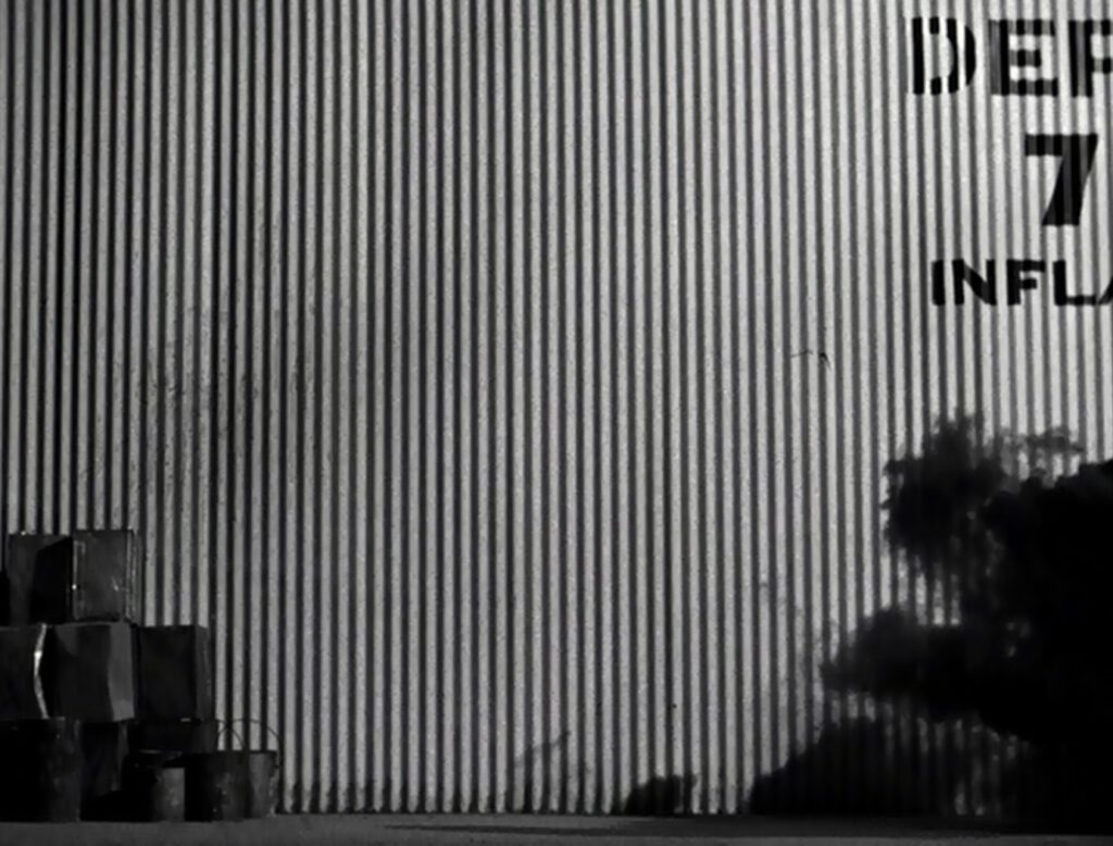 Saboteur - Alfred Hitchcock - aircraft factory fire - smoke - sheet metal wall