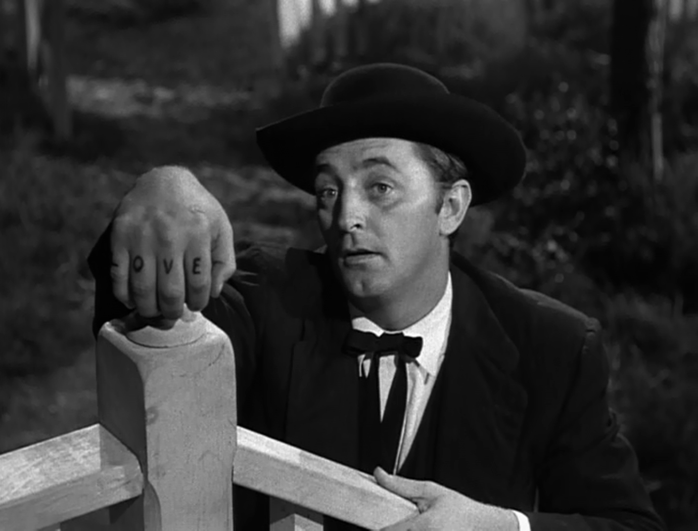 The Night of the Hunter - Charles Laughton - Robert Mitchum - Harry Powell - hand - love